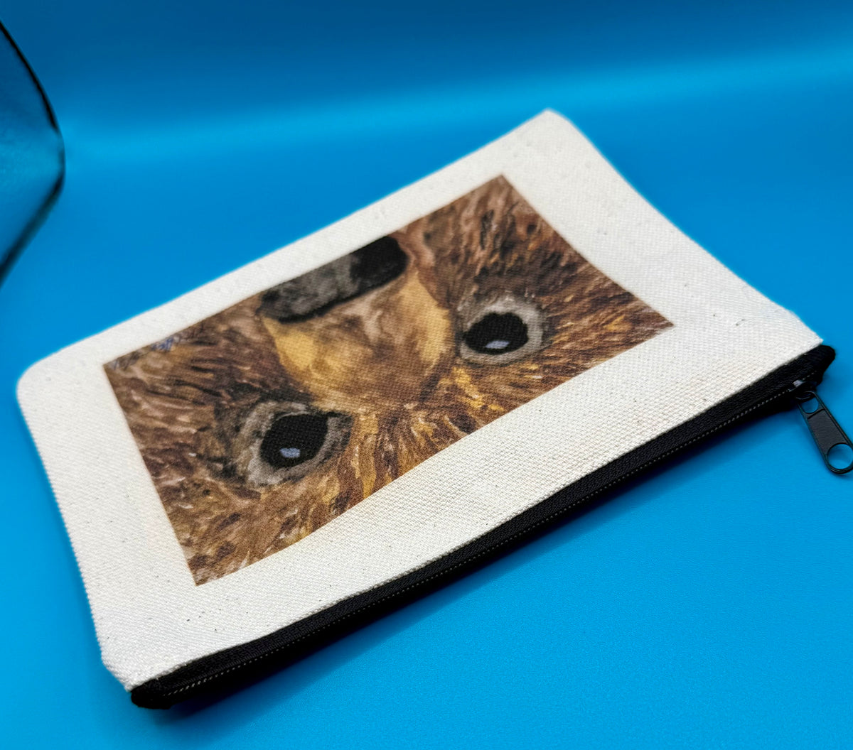 Small canvas zippered pouch featuring bear face original art called Hugo by Theresa Ritter