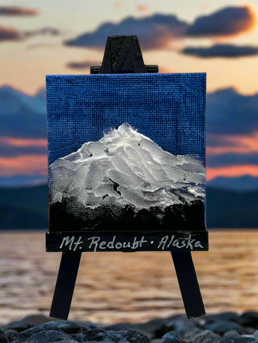 mini-canvas on easel with textured Mount Redoubt painting on it.