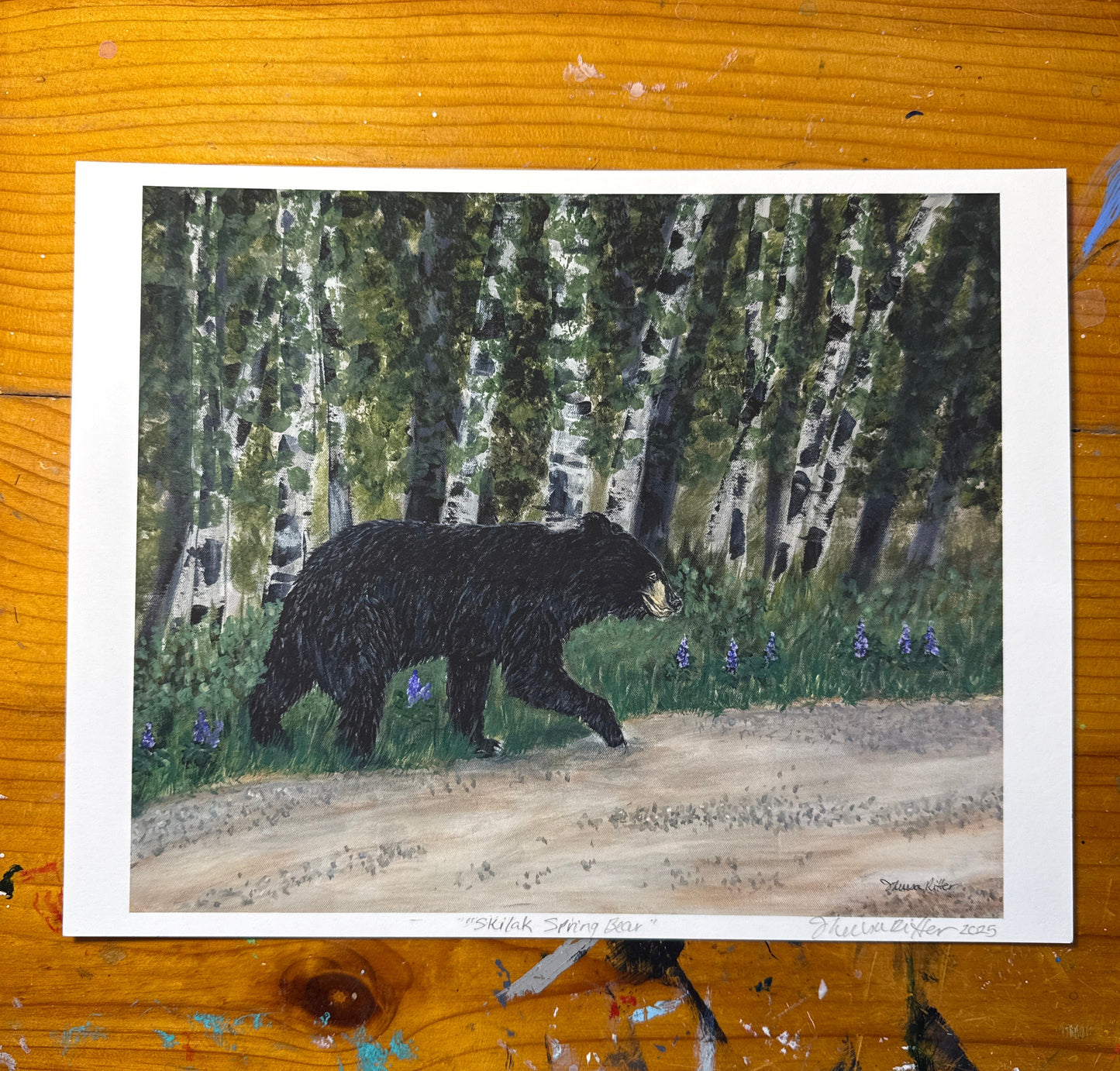Art print of acrylic painting featurning a black bear crossing the road 
