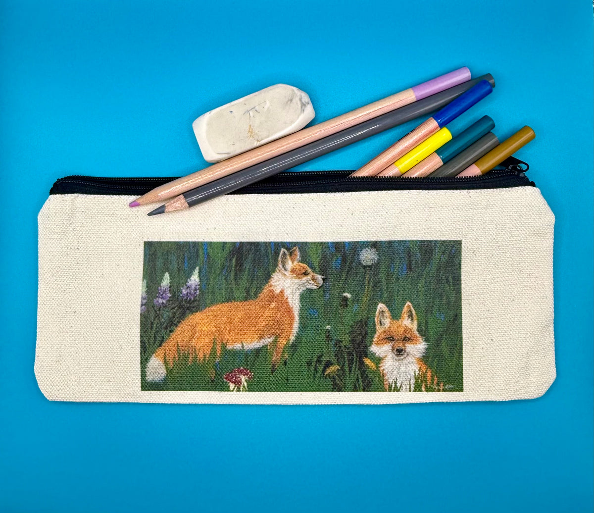 Pencil pouch with zipper pictured with examples of what it can hold.