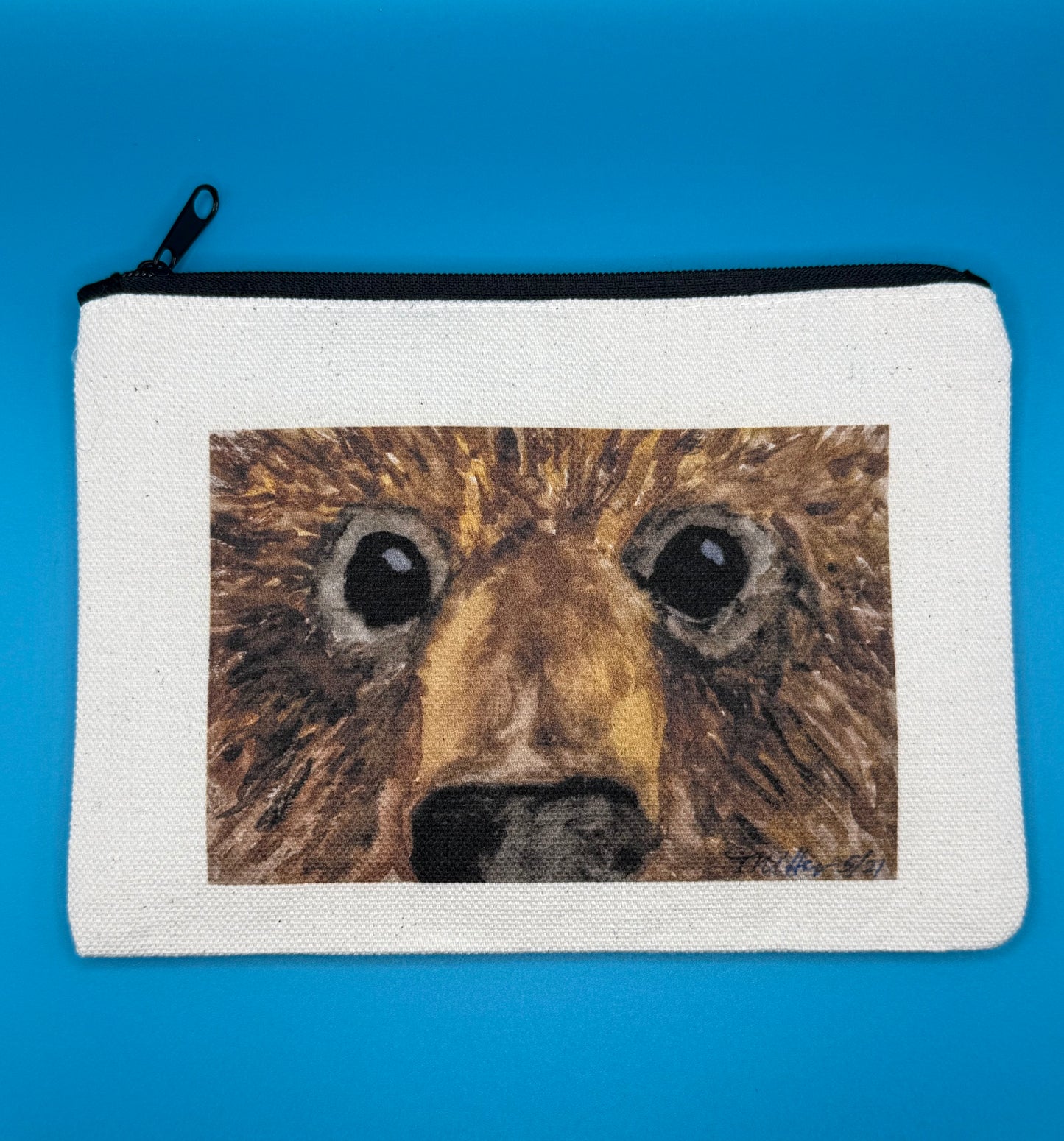 Small canvas zippered pouch featuring bear face original art called Hugo by Theresa Ritter