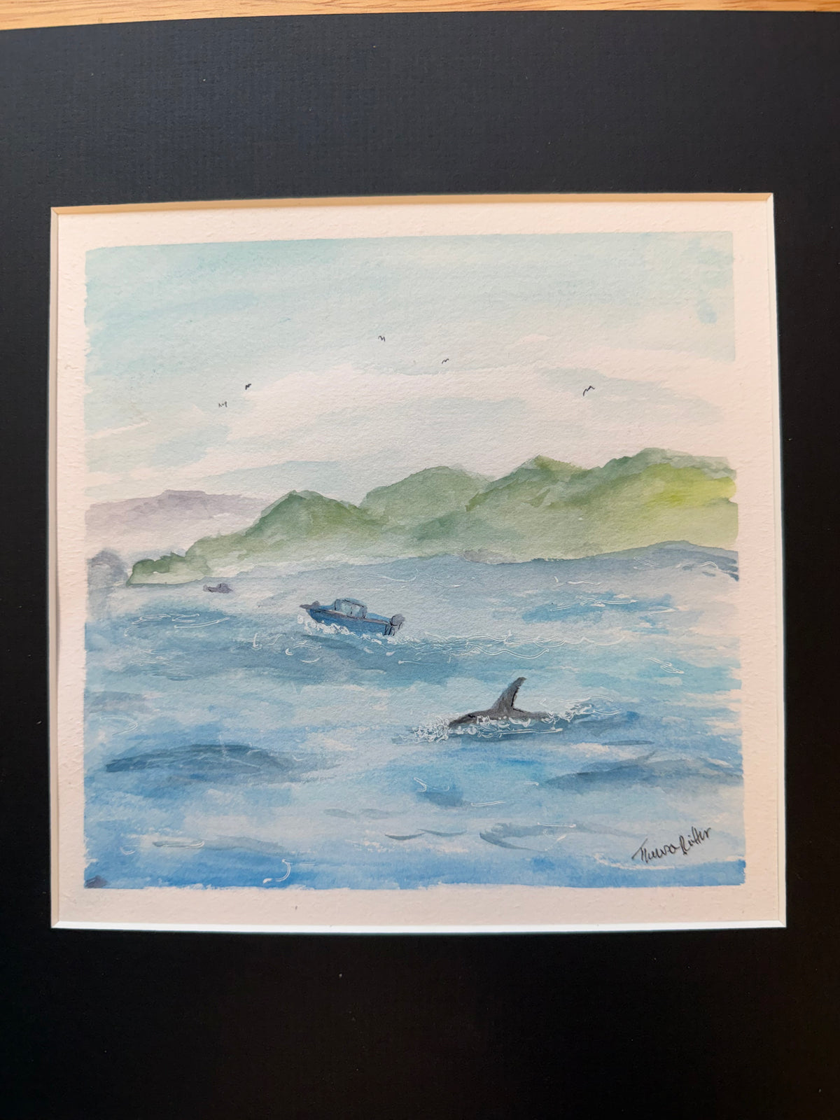 Closer image of boats and orca