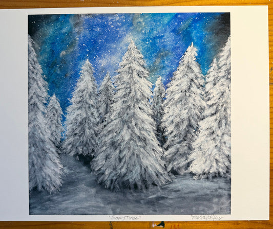 Snowy trees underneath an aurora filled sky